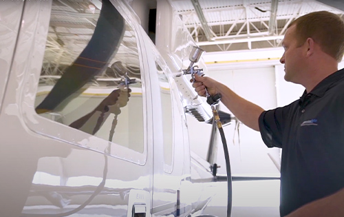 Certified System X Installer applying a ceramic coating to an aircraft