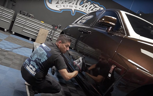 Vehicle being wiped clean at West Coast Customs