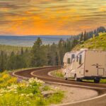 Ceramic coated RV driving down winding road in the mountains